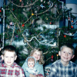 Another picture from Grandma Crum's, 1961. Mark, David, Pat (with doll) and Joe. From the earbud stuck in my ear, I would guess this is the year that we received Windsor transistor radios for Christmas. I still have mine.