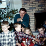 Christmas at home. 1961. Mark appears to be armed in this picture. Dad has that "Christmas morning after the presents are opened" look... :)