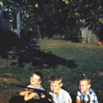 We 3 under the pear tree. Summer 1961. And I'm armed as usual.