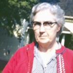 Grandma Crum, 1961. Not sure who took this, it's a little blurry. Her house is the background.