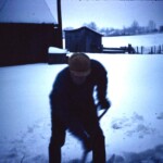 Grandpa (Oren) shoveling snow from the steps of his home. December 12, 1961
