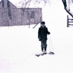 Joe in snow at Grandpa's, about 1960