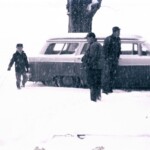 Joe, Oren, and Walter in snow at Grandpa's house.