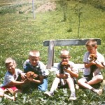 KidsAndPupsJuly28_1963 Taken in the backyard of our Allentown Road house. Dad was a pretty good gardener. I wish I had paid more attention. But he had the advantage of good Indiana black dirt.