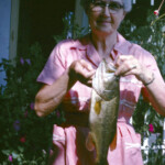 MomsFishAug29_1963_1PM; a great picture of Grandma Crum, with a nice bass she caught in the farm pond.