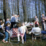 PicnicAtCrumsPondApril1963 This was a few years before Dad started building the house, which would have been in this picture. You can see grandpa Offutt's barn in the background on the right.